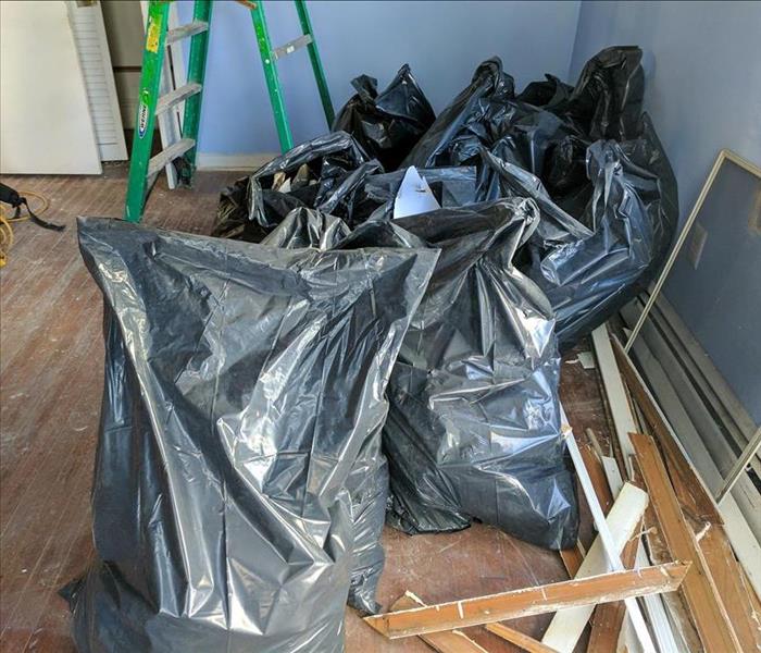 bags of debris from storm damage