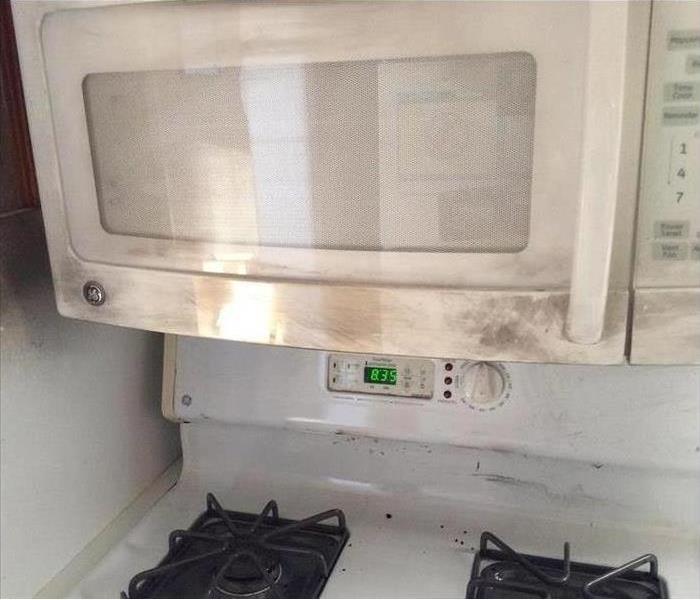 A kitchen with fire damage